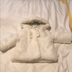 White faux fur coat